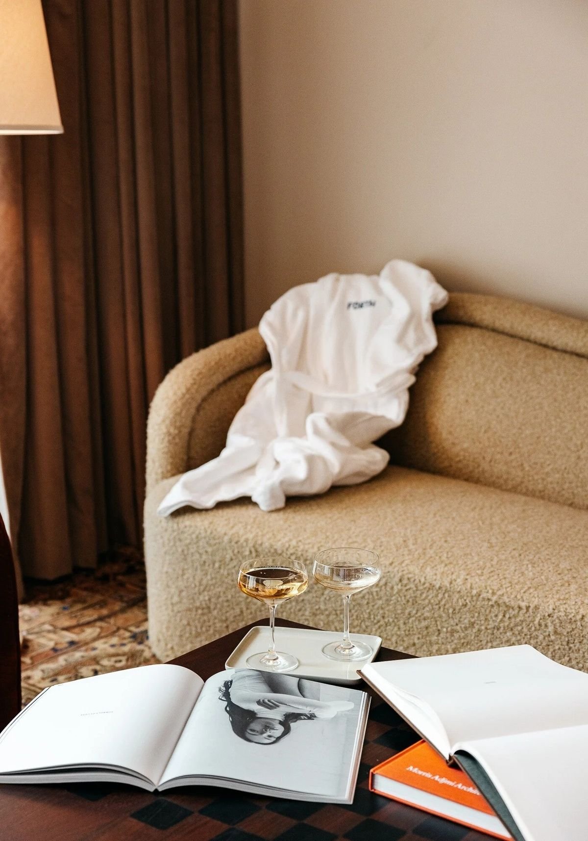 Robe and open books on a lounge chair in a SOMA suite
